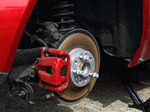 Car wheel being changed on the side of a road